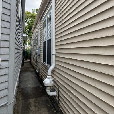 Radon Mitigation System on the outside of Home
