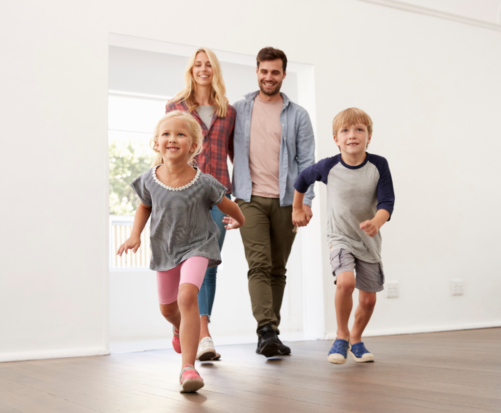 Happy family entering home with safe, clean air.