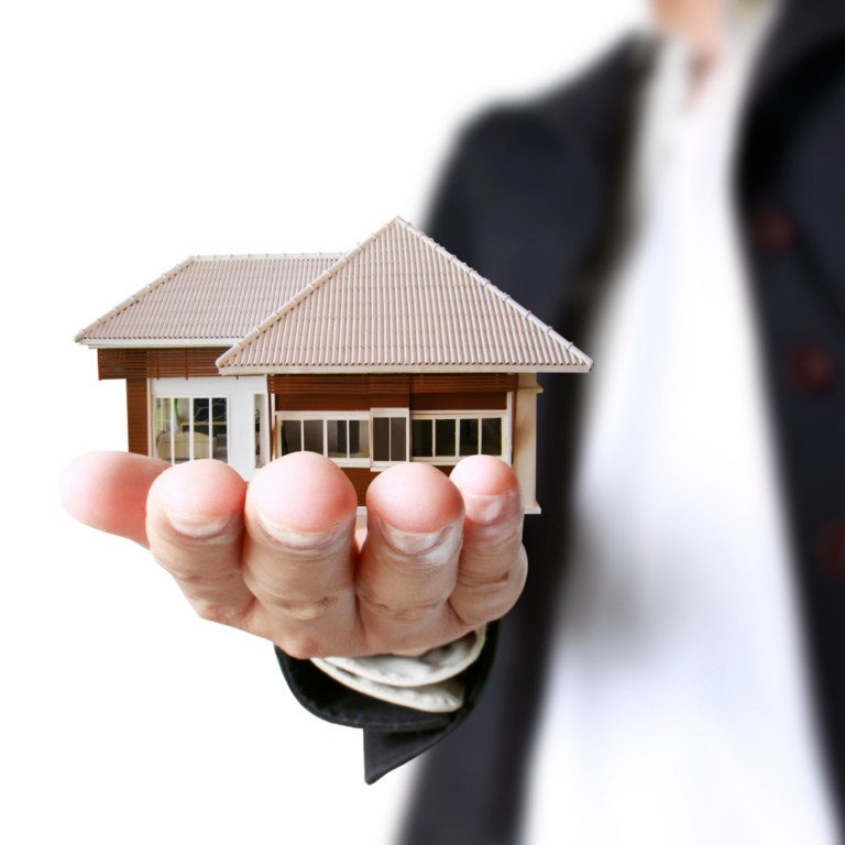 Man holding house in hand as a real estate partner for radon testeig