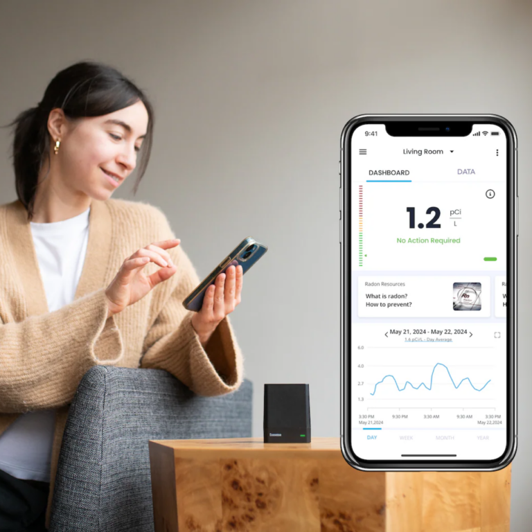 Woman looking at an air quality monitoring app for her home